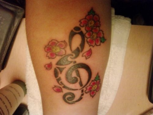 treble clef tattoos. The treble clef is in memory