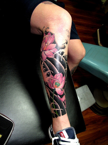Fabulous Japanese style half leg tattoo Love the lotus fuckyeahtattoos 