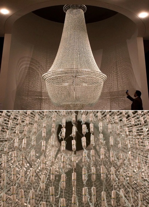 Chandelier of the Day: &#8220;A Noiva&#8221; (The Bride), a five-meter high (16.5 feet, in English) chandelier by Portuguese artist Joana Vasconcelos made up of thousands of illuminated tampons, is currently on display at the at Belem Cultural Center in Lisbon as part of the artist&#8217;s &#8220;Netless&#8221; exhibition. [telegraph.]