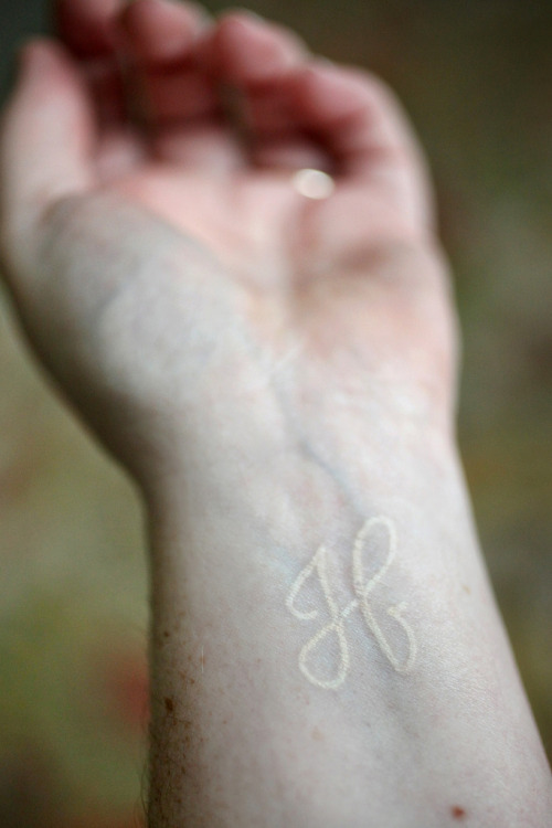 White ink initial tattoo by JHendersonStudios on flickr (click)