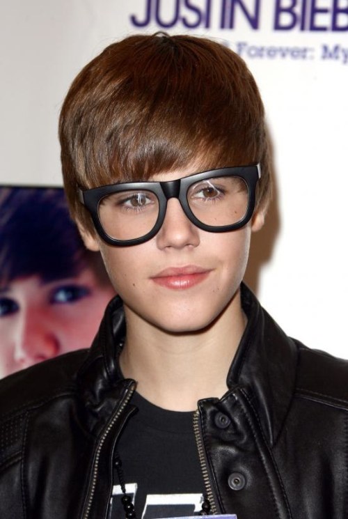justin bieber with glasses on. On white housejustin ieber