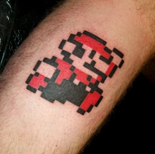 I saw the Paper Mario tattoo and though i would post my 8bit Super Mario 
