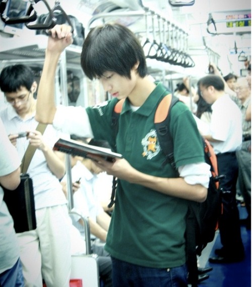 
Young Min at the subway reading a manga.
