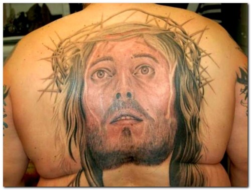 A subtle Jesus back tattoo