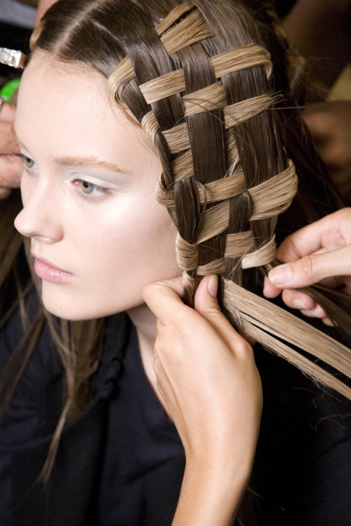 Basketcase
A how-to look at getting the Alexander McQueen spring 11 woven hairstyle by Guido. What you’ll need: unlimited amounts of hairspray and defrizzer, straightening iron, extensions, and 2 patient friends.
Check out some of our favorite tress tamers for the season here!
Photo: Imaxtree