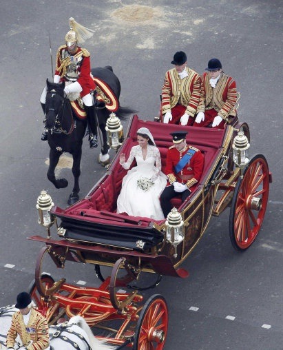 foreverinlovewithfootwears:

The Duke and Duchess of Cambridge travel in a 1902 State Landau along the Procession Route after their wedding in Westminster Abbey, 29 April 2011. (Source: Flickr)
