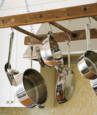 You need a ladder hanging rack in your house. Old ladders can be used  for so many other purposes than reaching high places. You can repurpose  them into book shelves, towel racks, and garden trellises. Click for the  article that shows you how to upcycle and old ladder into my favorite, a  cool hanger for your pots and pans.