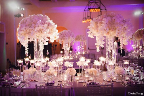 Full table setting with white orchids candles and purple linens Wedding