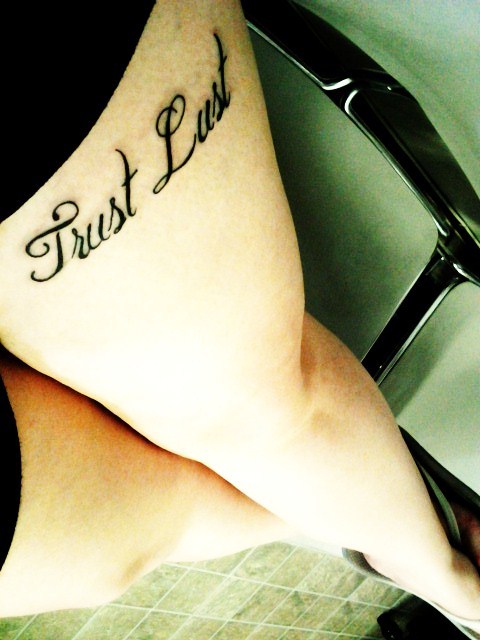 It reads Trust Lust on my left upper thigh Love it