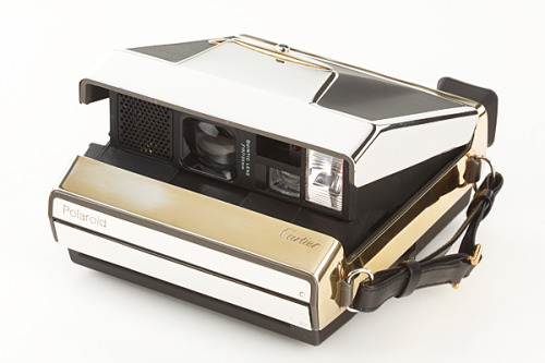 photojojo:

Only 4 golden Cartier Polaroid cameras were made in 1988. Each are 22 carat with 3 shades of gold. 
It may just be the shiniest camera we’ve ever seen.
The Cartier Gold Polaroid at the WestLicht Photographica Auction
via mijonju

WOOAAAAHHHH.