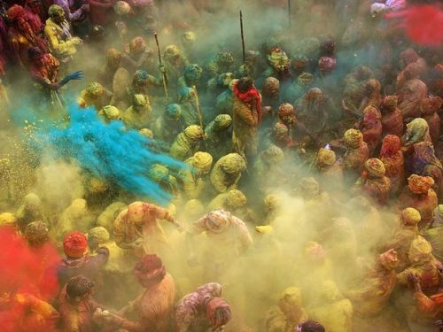 Holi Celebration, IndiaPhoto: Anurag Kumar
What makes this shot work is the dramatic burst of blue spurting into the crowd. No matter how frenetic and energy-filled the scene is, there still needs to be a moment among the frenzy. The blue hand also gives us one sharp point of focus in a sea of turbaned heads. Importantly, the vibrant blue contrasts so well with the yellows and the reds, making the whole scene alive with vitality.