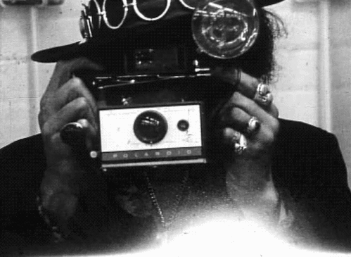 Jimmy Hendrix with a Polaroid