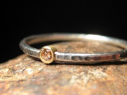 weddingwants An extremely simple ring The hammered metal with a small gem 