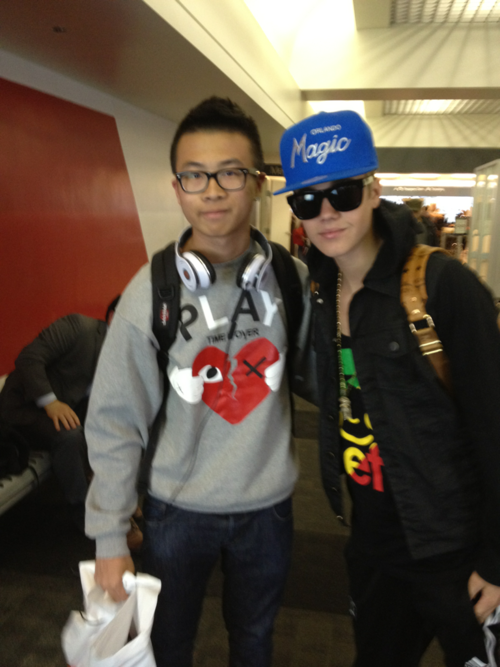 Justin with a fan at LAX - April 12
