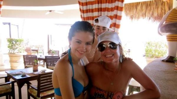 Selena Gomez with Shannon in Cabo. Justin Bieber doing a photo bomb.
