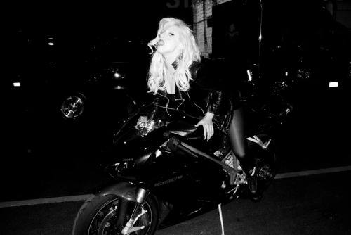 Lady Gaga on a motorcycle.